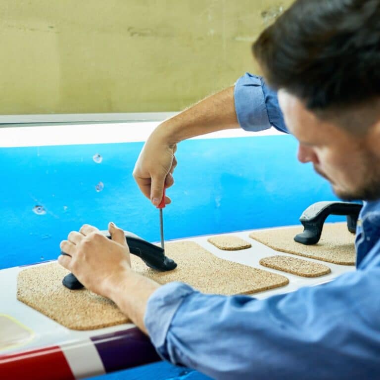 Man performing waterproofing application for a pool